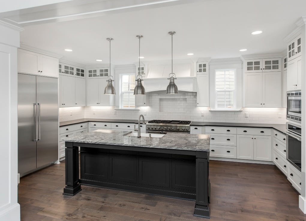 Transitional white custom kitchen cabinets and LVT plank flooring